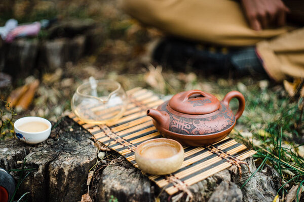 Tiny tea ceremony outdoor  on the ground in daylight
