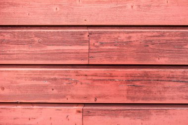 Ahşap duvar plakalar küçük çatlaklar ile doku. Kırmızı ve pembe renkli ahşap plakalar.