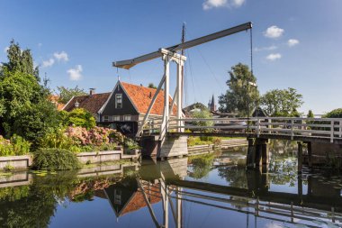 Historic bridge Kwakelbrug over a canal in Edam, Netherlands clipart
