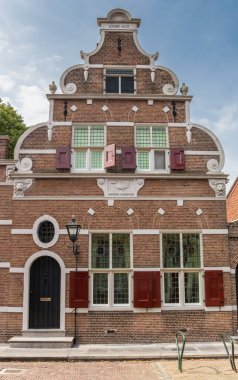 Decorated facade of a monumental house in Monnickendam, Holland clipart