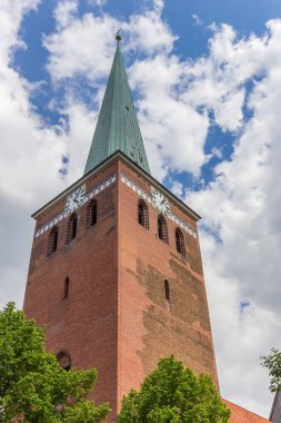 Tower of the St. Marien church in the historic center of Uelzen, Germany clipart