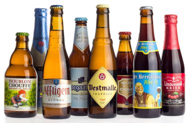 Collection of Belgian La Chouffe, Affligem, Hoegaarden, Westmalle, Delerium, Lindemans,  Chimay and St. Bernardus beers isolated on a white background clipart