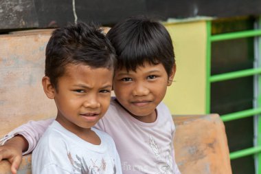 Two malasian boy looking at the camera at Pangkor island, Malaysia clipart