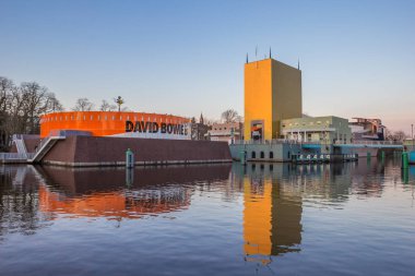 Modern building of the Groningen museum with exhibition dedicated to David Bowie clipart