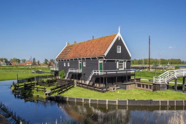 Wooden cottage at the lake in Enkhuizen, Holland clipart