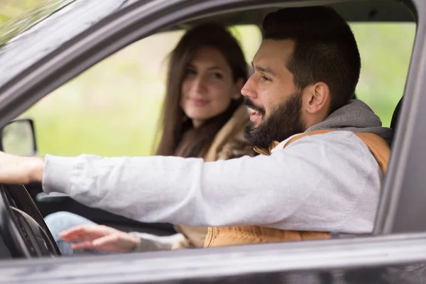 couple in car in the mountains