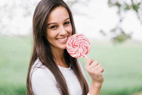Young sexy woman with lollipop.