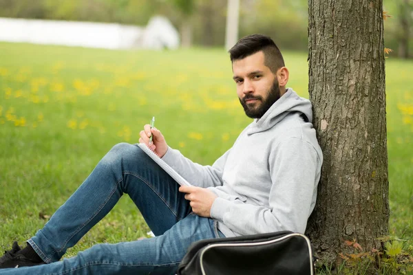 Young Man Sitting Bench Reading Book — Stock Photo, Image