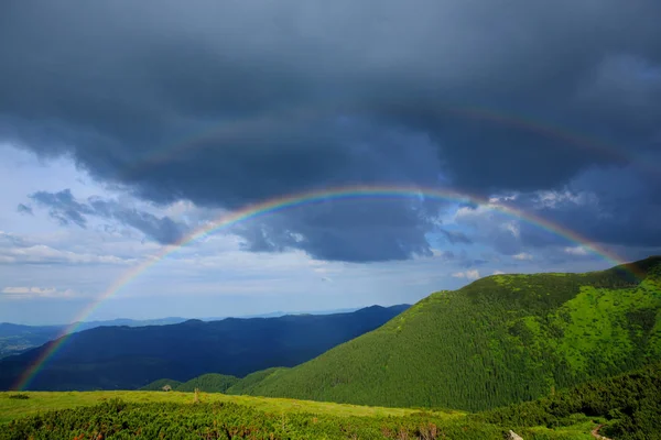 Rainbow in the mountains. — Stock Photo, Image