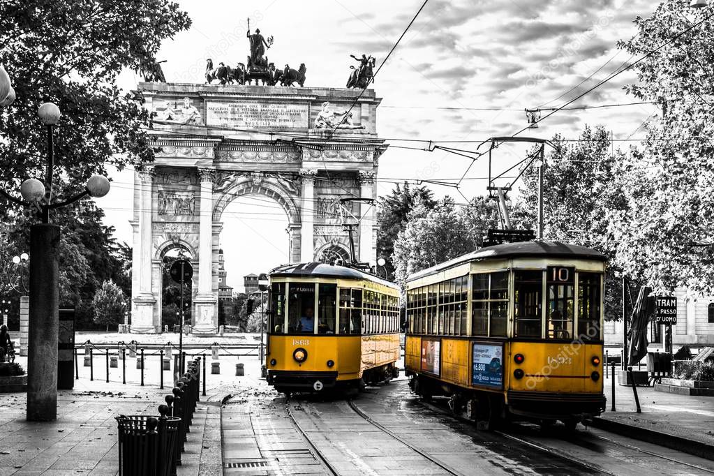 Tram in Milan with peace arch in the background