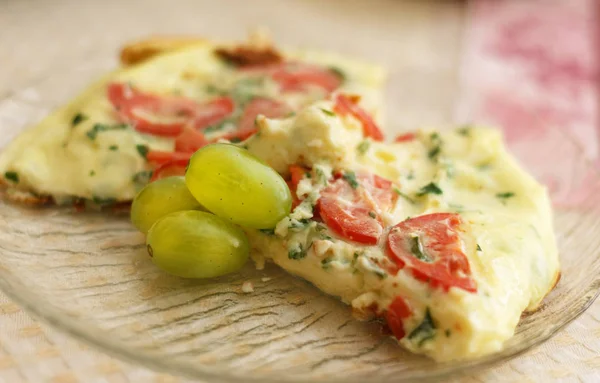 tasty magnificent omelet with greens for breakfast