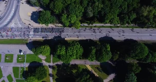 Aerial shot of marathon runners on asphalt road