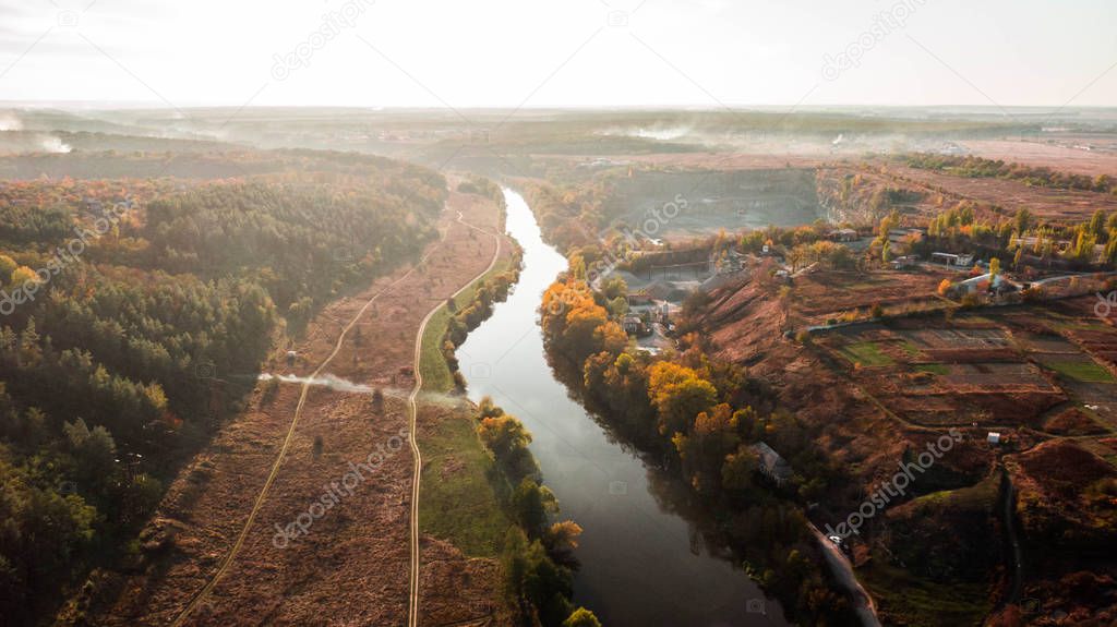 drone with a camera, beautiful river through career and forest. C