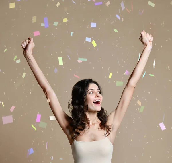 Happy successful young woman with raised hands shouting and celebrating success — Stock Photo, Image