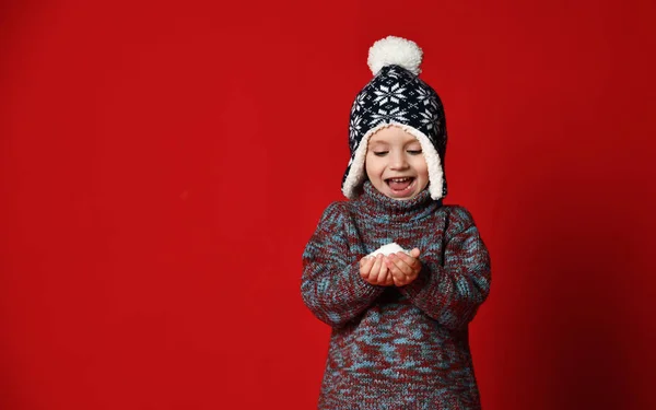 Winter portrait of cute little boy wearing warm cozy clothes studio shot with snow — Stock Photo, Image