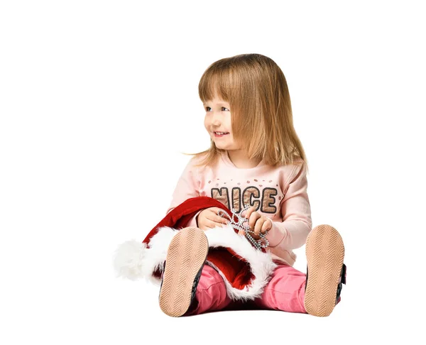 Adorable two year old child sitting on the floor at studio isolated on white — Stock Photo, Image