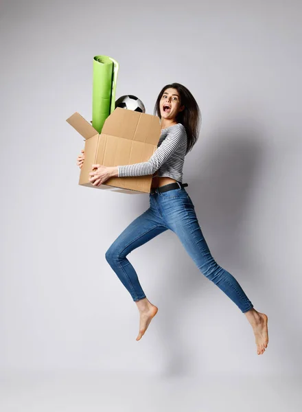 Young woman holding box with things. — Stock Photo, Image