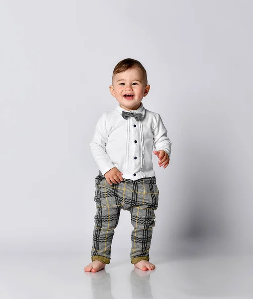 Happy baby. Little boy in a white shirt and bow tie. Children portrait. Stylish man in fashionable a bow-tie. — Stock Photo, Image