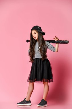 Young bright american girl with baseball bat clipart