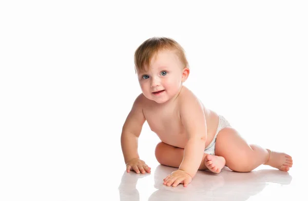 Portrait of a smiling little baby boy with blue eyes on a white background. — Stock Photo, Image