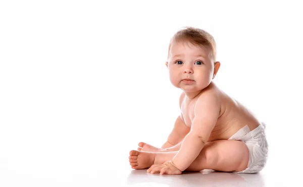 Baby sitting on floor over white copyspace — Stock Photo, Image