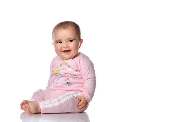 Cute little girl laughs looking at the camera on a white background. — Stock Photo, Image