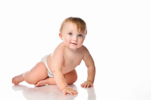 Portrait of a smiling little baby boy with blue eyes on a white background. — Stock Photo, Image