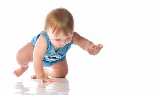 Beautiful baby in a shirt crawling and laughing — Stock Photo, Image
