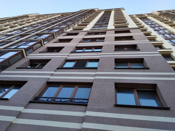 view of the skyscraper from below, high residential building for life and work. many people in one place, life in the metropolis