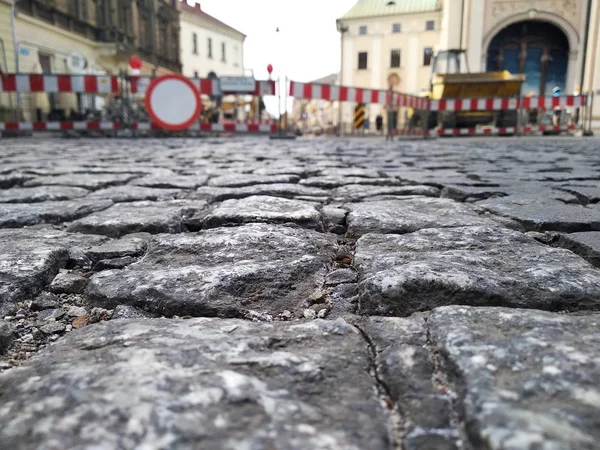 repair of roads in the Old city. the overlap of the roadway on the background of bars and old buildings, replacement of rails for trams, public transport. collapse in the city center. replacement of a