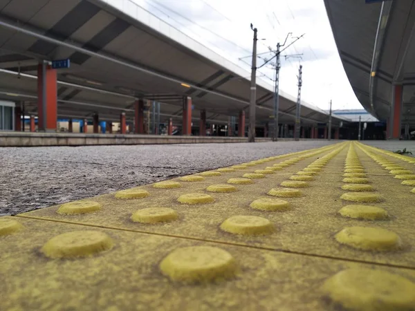 traffic safety for people with visual impairment. special equipment for the free movement of persons with disabilities. bright yellow tiles with tactile elements.