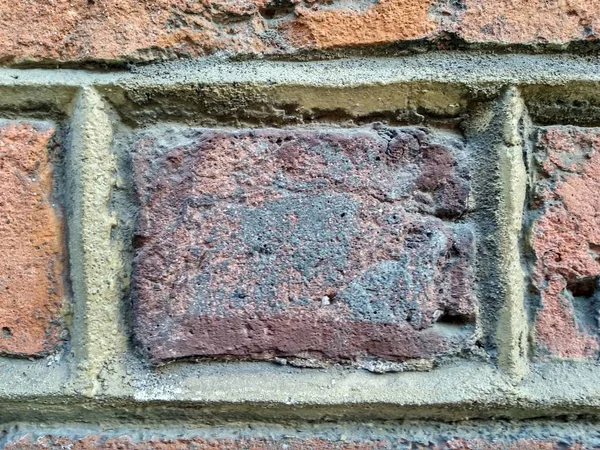 old red brick with seams between the masonry. the cement solution is evenly laid between the bricks. background, background, structure