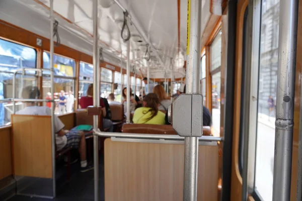 interior of the old city tram,button to call the driver, the communication button in the old city public transport. opening the door in manual mode old style, tourist tram, interior details