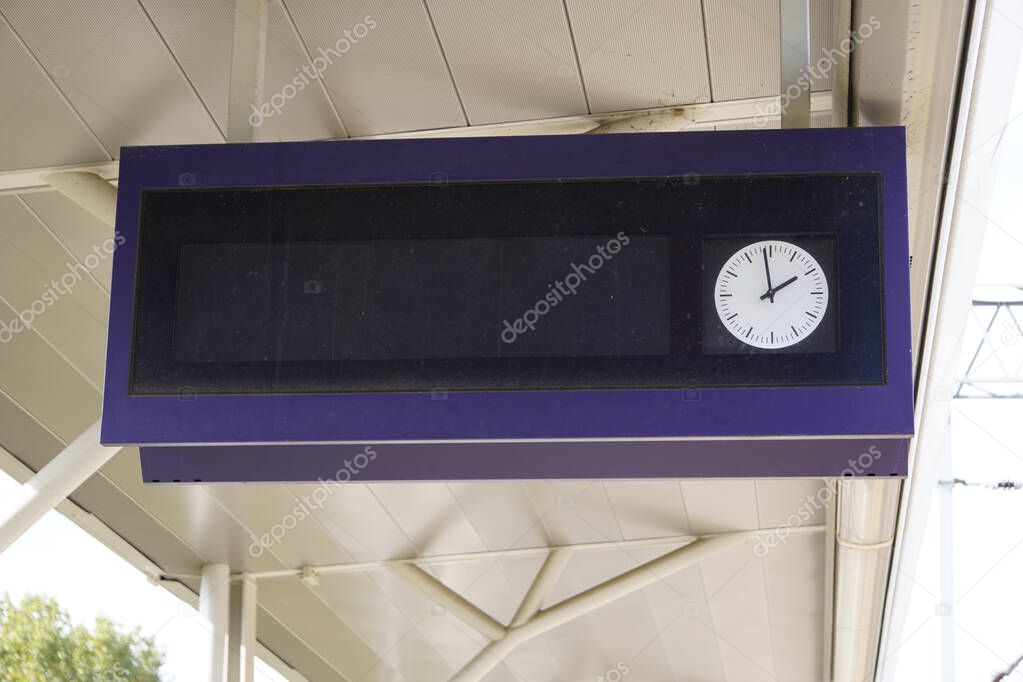 scoreboard at the station with a clock for the schedule, track and platform, as well as the departure time. waiting for the arrival or departure of trains, trains
