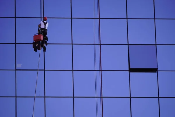 industrial climbing, cleaning of Windows, glass elements of the building. maintenance of skyscrapers. hard work