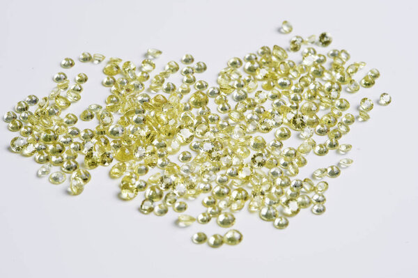 Group of little faceted yellow sapphires.