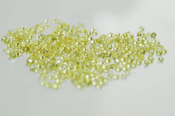 Group of little faceted yellow sapphires.