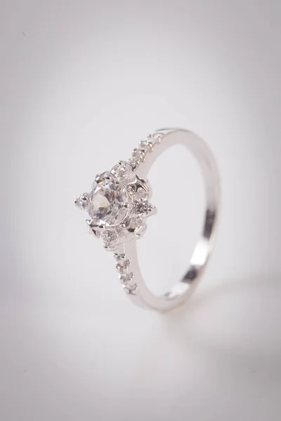 Close up of elegant diamond ring on the white background. Diamond ring.