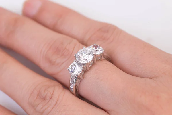 Close up of elegant diamond ring on the white background. Diamond ring.