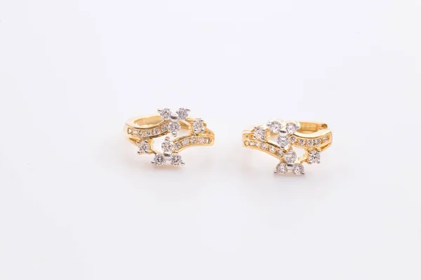 Earrings. Gold Hoop Earrings with diamonds on the white background.