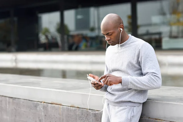Attractive Black Man Listening Music Headphones Urban Background Male Sportswear — Stock Photo, Image