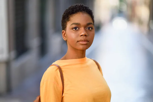 Young African woman wearing casual clothes looking at camera. — Stock Photo, Image