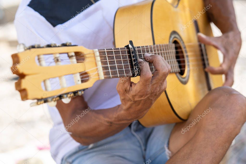 Flamenco musician playing Spanish guitar in Granada..