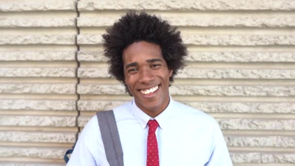 Happy Black man smiling outdoors. Guy with afro hair. — 图库视频影像