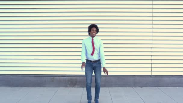 Black Businessman jumping outdoors. Man with afro hair. — Αρχείο Βίντεο