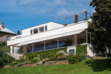 Brno, Czech Republic - September 13 2020: Villa Tugendhat Modernist House designed By Mies van der Rohe in the International Bauhaus Style viewed from the Garden. clipart