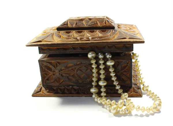 Wooden rectangular box with ornaments made of natural semi-precious stones. Handwork. necklace with white pearls.