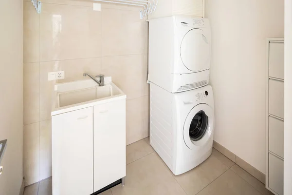Laundry room with modern washer and dryer, nobody inside