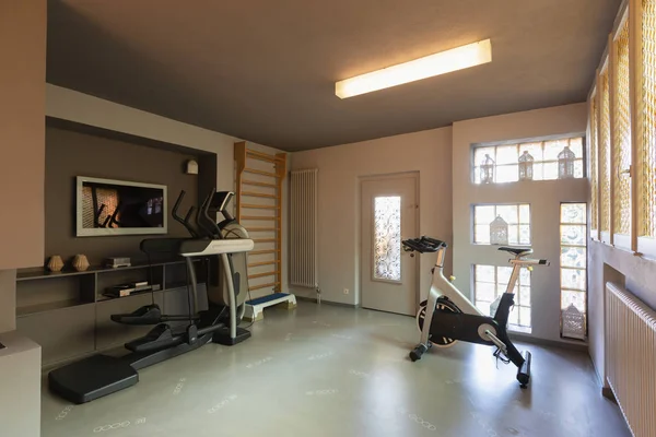 Private gym with exercise bikes, treadmills and espalier for exercises. Nobody inside