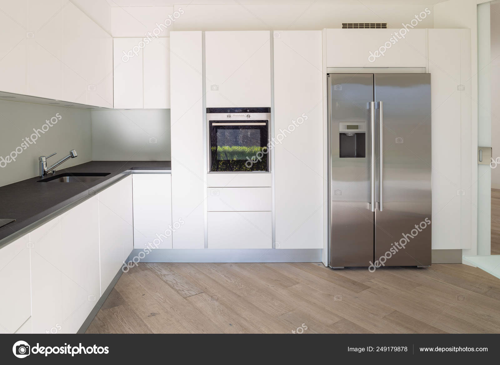 White minimalist modern kitchen front view Stock Photo by ©Zveiger